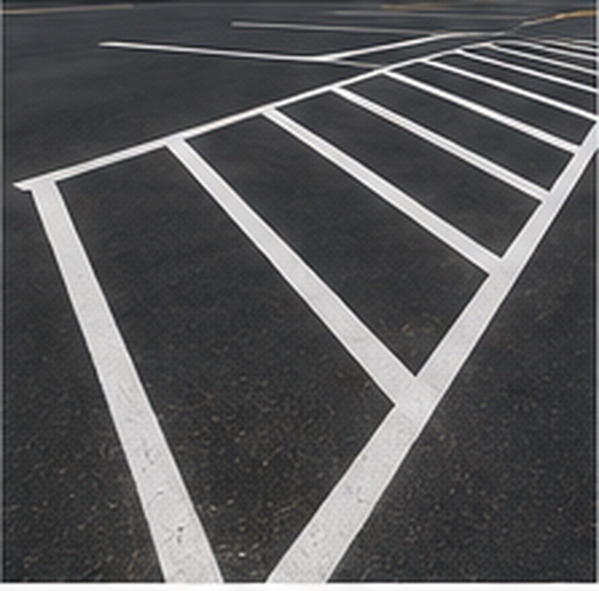 No-parking hatched access aisle striping alongside an accessible space