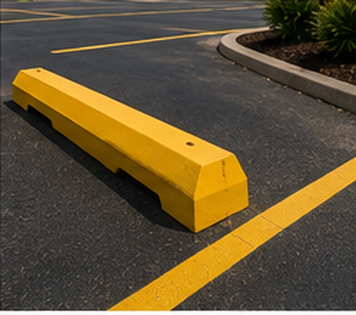 Wheel-stop installation on a Wichita commercial parking lot